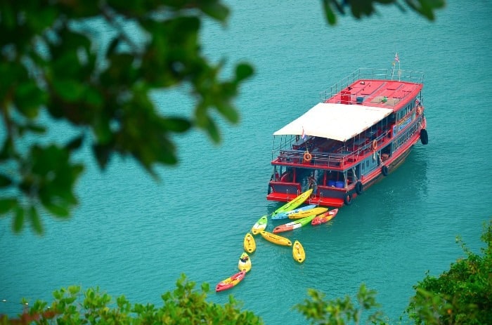 Slower Ferry Boat is waiting in the bay for its passengers. Ang Thong National Marine Park kayak tour.