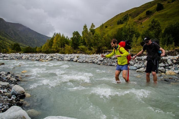 Wading the glacier river barefoot