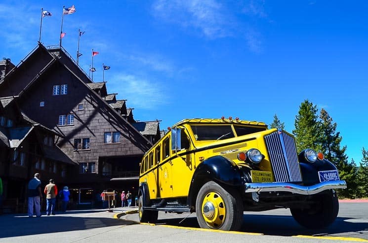 Historical vehicle in front of the Old Faithful Inn. 